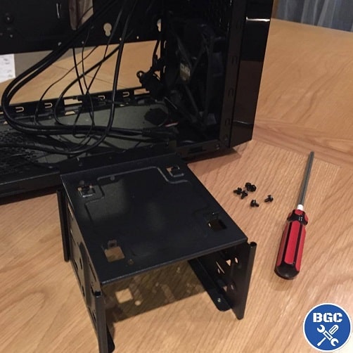 Removing a storage drive rack in the bottom of a PC case Removing a storage drive rack in the bottom of a PC case